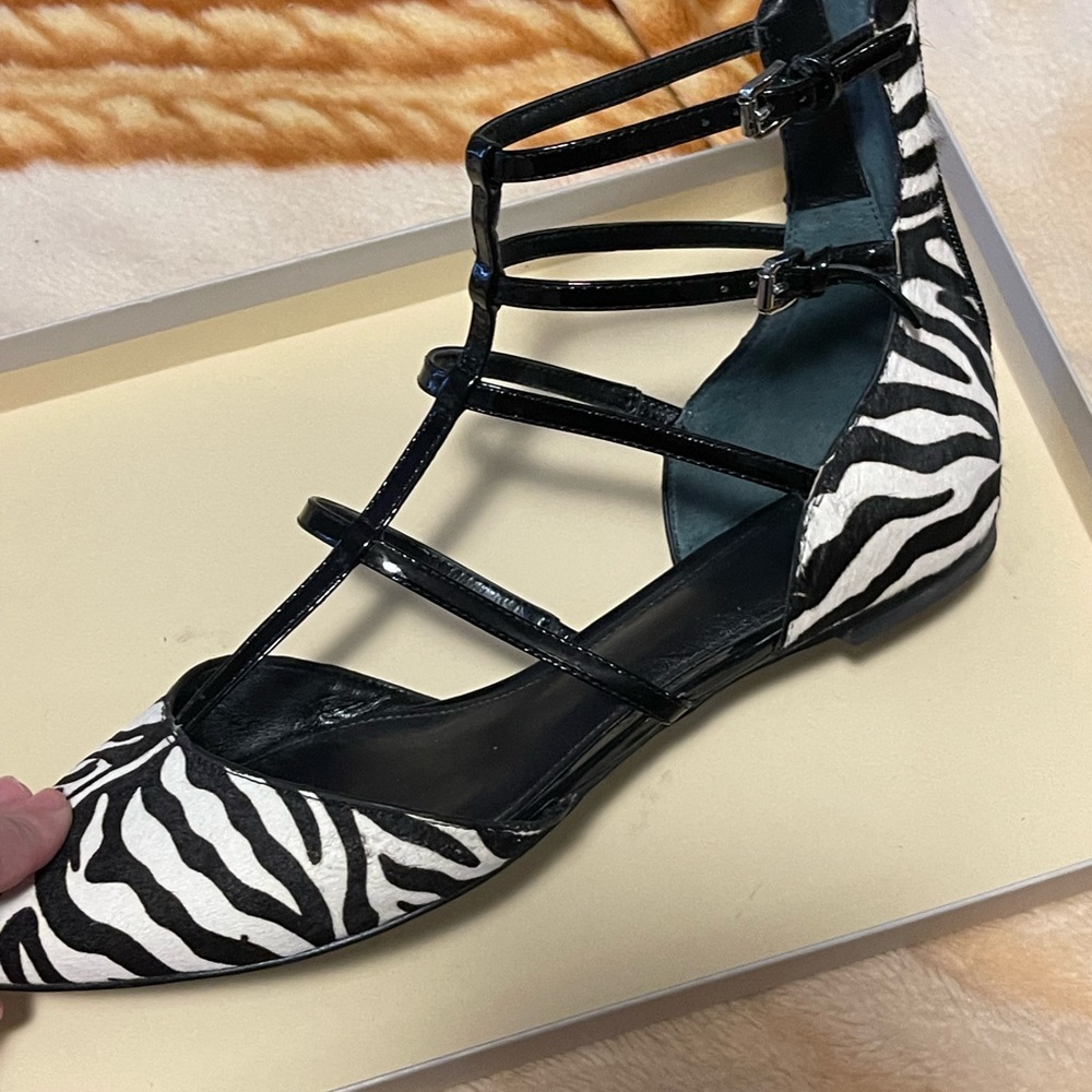 Awesome Mary Jane shoes. Neutral colors and will match with anything.